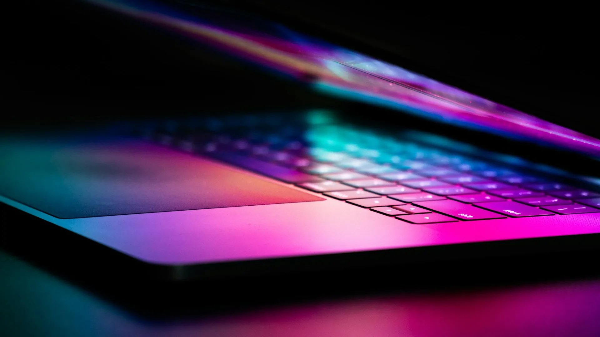 Illuminated laptop in a digital environment, visual representation of Platonica Presence commercial information infrastructure